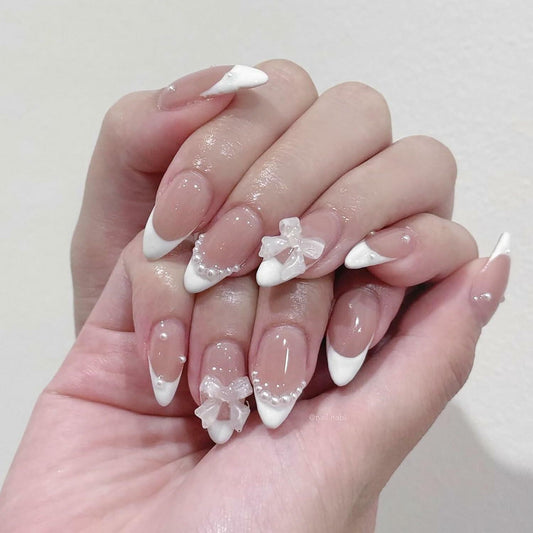 RIICFDD 24Pcs Medium Almond French Tip White Fake Nails 3D Bow Pearl Charms